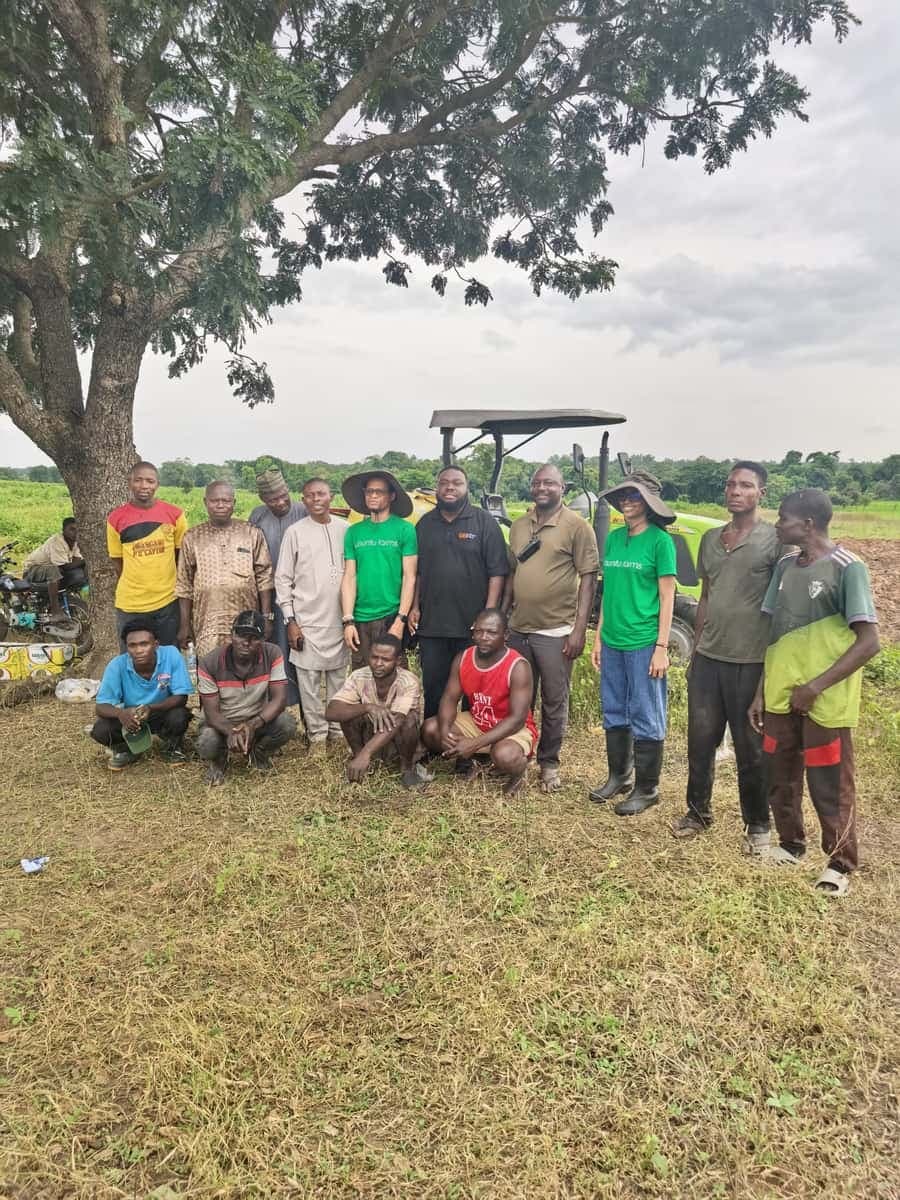 Ubuntu Farms team with community members and elders under a large tree