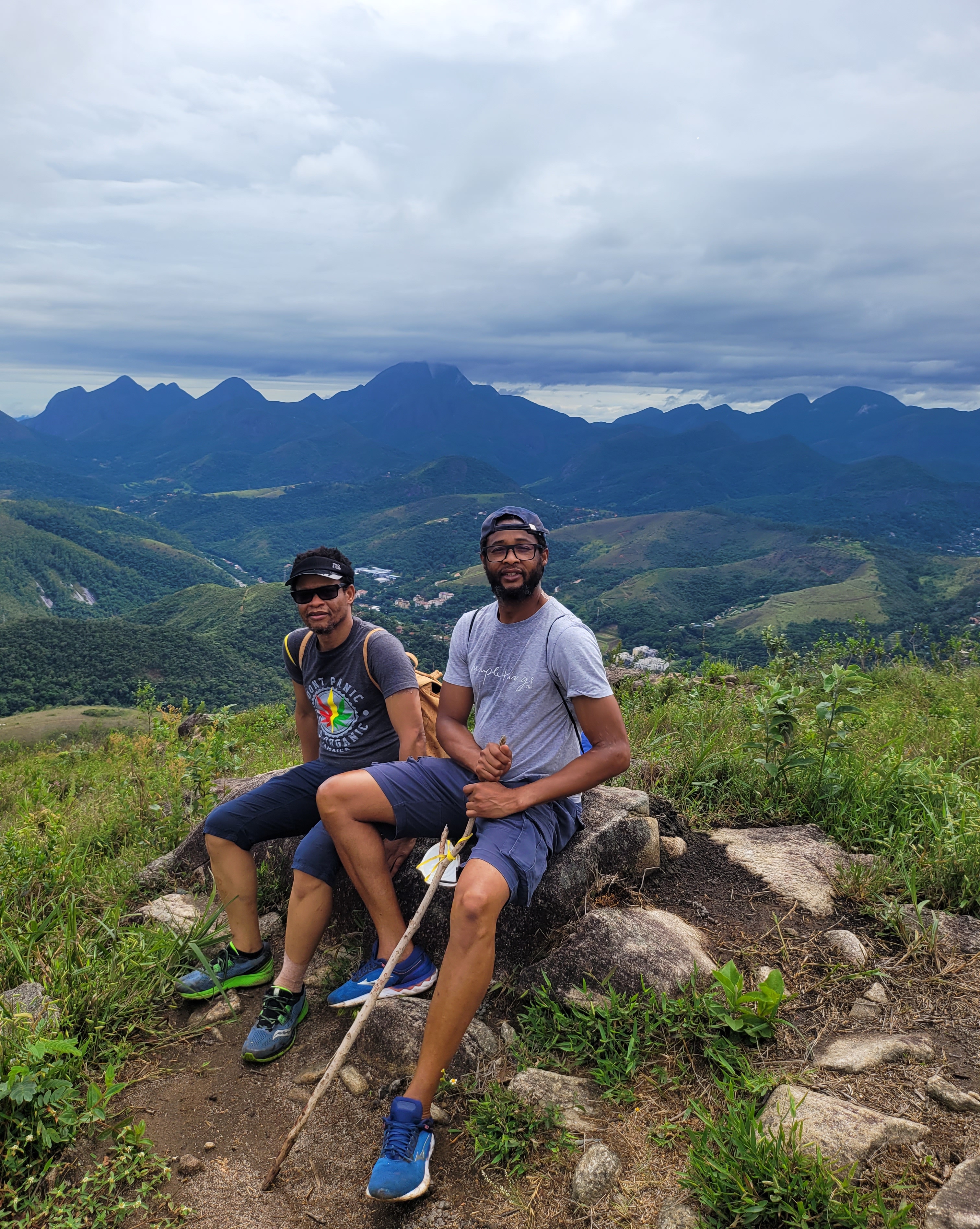 Ubuntu Farms team members on rocks with mountains - showcasing our commitment to agriculture